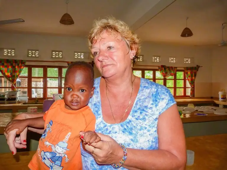 Sue Hayward holding Harry a child found in Kenya