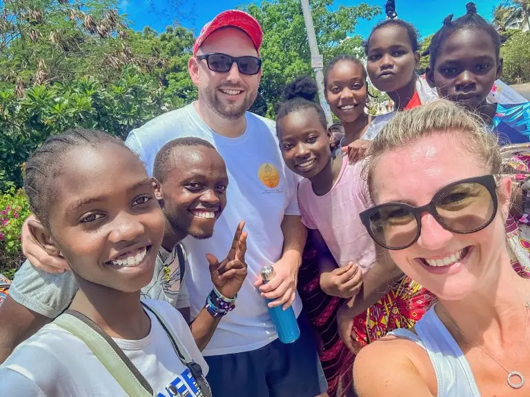 Two sponsors in Watamu Kenya with the children of the Happy House