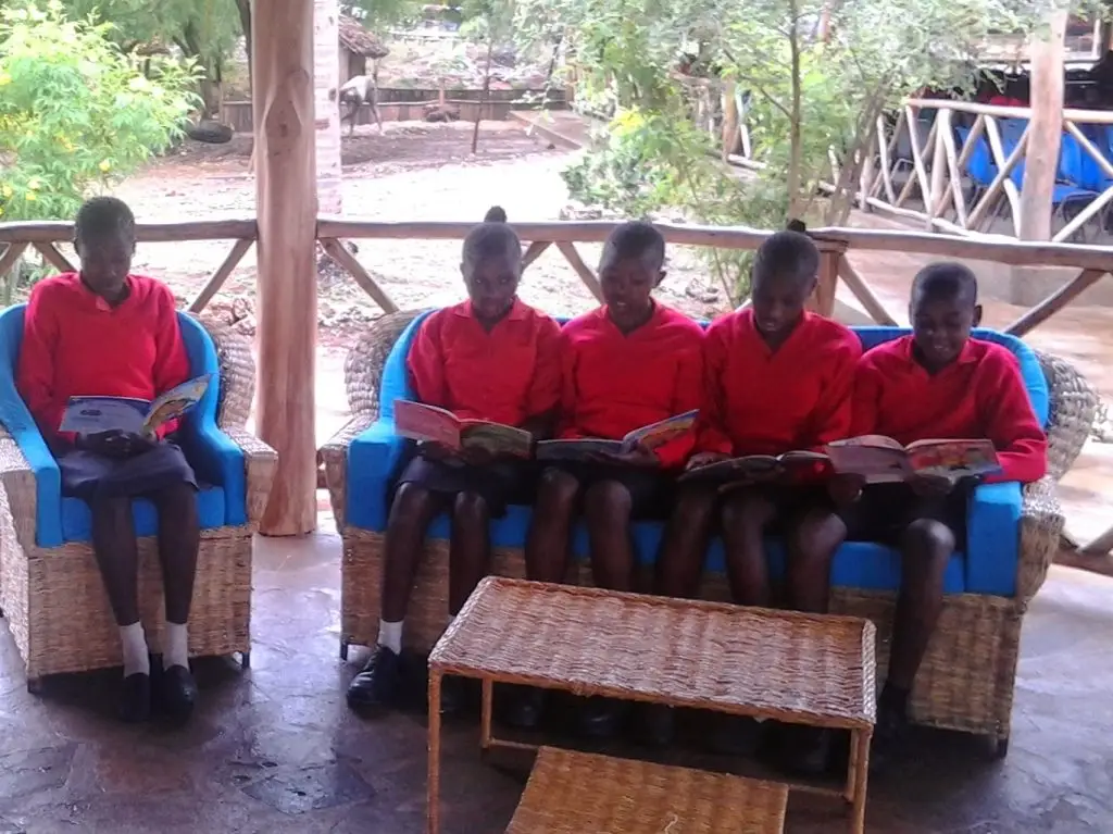 Children at reading at the Happy House