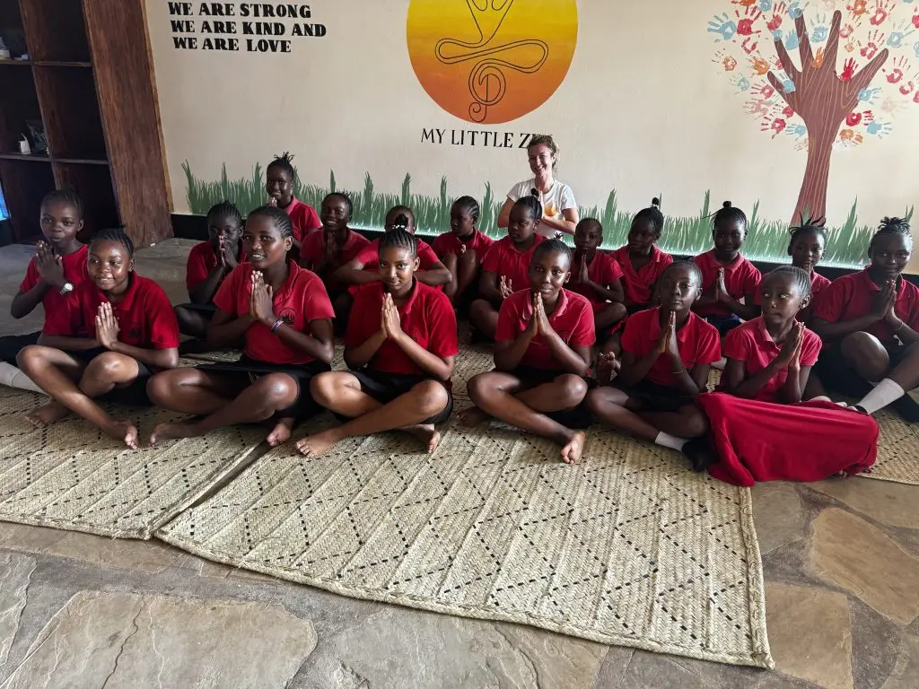 A group of girls from the Happy House school taking part in a yoga classes